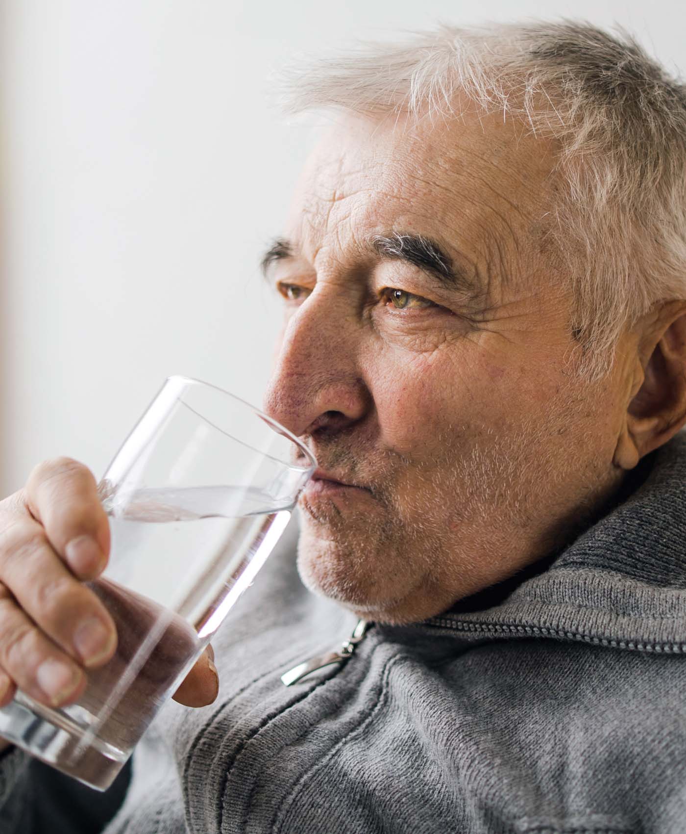 Elder Gentleman Drinking from a Water Glass