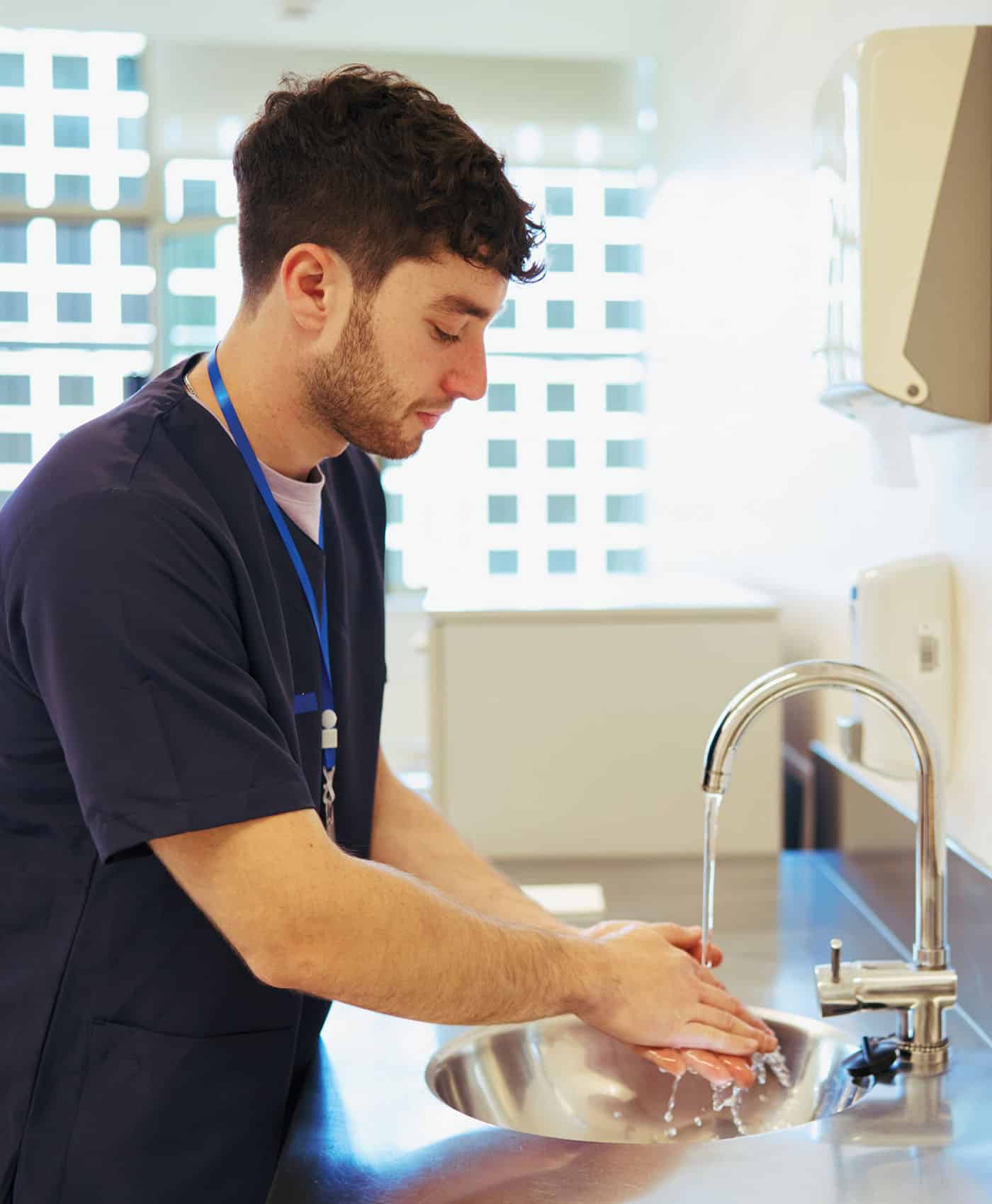 Male Nurse Washing Hands